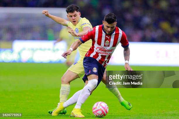 Richard Sanchez of America fights for the ball with Alexis Vega of Chivas during the 15th round match between America and Chivas as part of the...