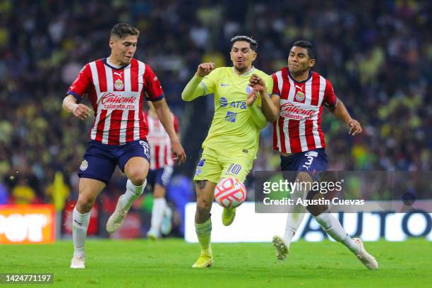Diego Valdes of America fights for the ball with Jesus Olivas and Gilberto Sepulveda of Chivas during the 15th round match between America and Chivas...