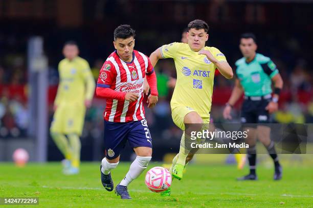 Fernando Beltran of Chivas fights for the ball with Richard Sanchez of America during the 15th round match between America and Chivas as part of the...