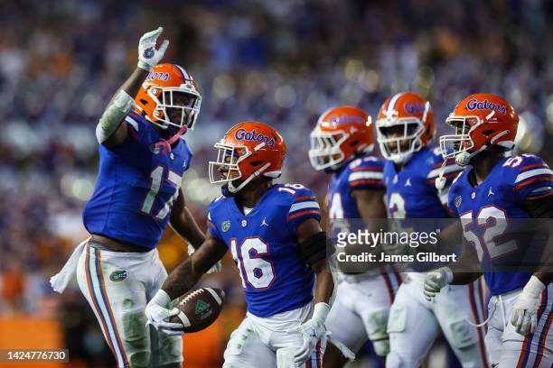 Tre'Vez Johnson of the Florida Gators celebrates with teammates after intercepting a pass during the 4th quarter of a game against the South Florida...
