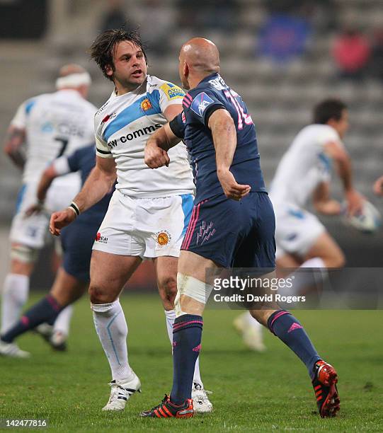 Felipe Contepomi of Stade Francais throws a punch at Chris Whitehead during the Amlin Challenge Cup quarter final match between Stade Francais and...