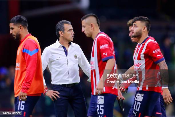 Head coach Ricardo Cadena , Roberto Alvarado and Alexis Vega of Chivas react after the 15th round match between America and Chivas as part of the...
