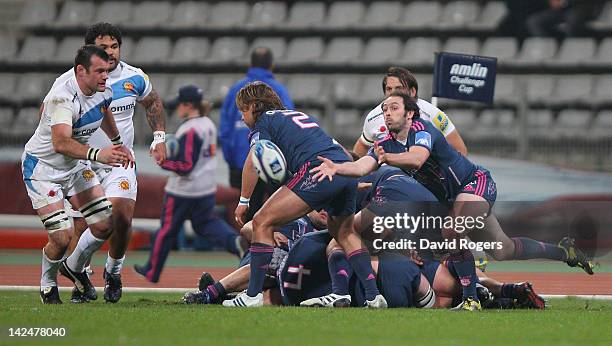 Julien Dupuy of Stade Francais passes the ball during the Amlin Challenge Cup quarter final match between Stade Francais and Exeter Chiefs at Stade...