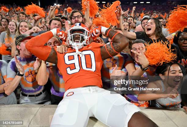 Jabriel Robinson of the Clemson Tigers jumps into the student section before their game against the Louisiana Tech Bulldogs at Memorial Stadium on...