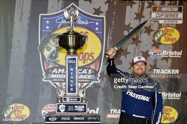 Chris Buescher, driver of the Fastenal Ford, celebrates in victory lane after winning the NASCAR Cup Series Bass Pro Shops Night Race at Bristol...