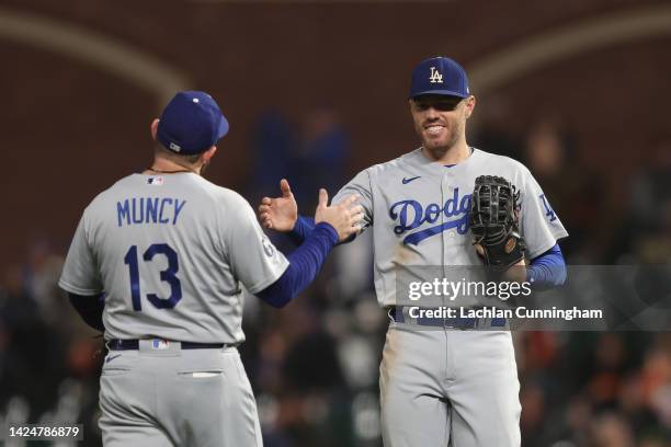 Max Muncy and Freddie Freeman of the Los Angeles Dodgers celebrate after a win against the San Francisco Giants at Oracle Park on September 17, 2022...