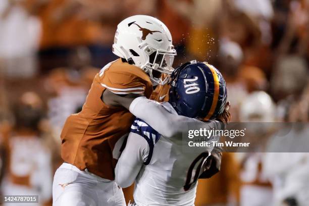 DeMarvion Overshown of the Texas Longhorns hits Frank Harris of the UTSA Roadrunners, but is called for targeting in the fourth quarter at Darrell K...