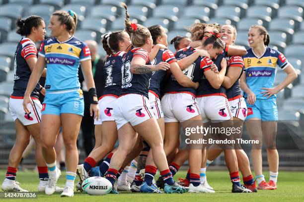 Shaniah Power of the Roosters celebrates a try with team mates during the round five NRLW match between Gold Coast Titans and Sydney Roosters at...