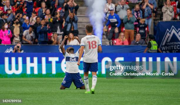 Leonard Owusu and Alessandro Schopf of the Vancouver Whitecaps FC celebrate the Whitecaps victory over the Seattle Sounders FC at BC Place on...