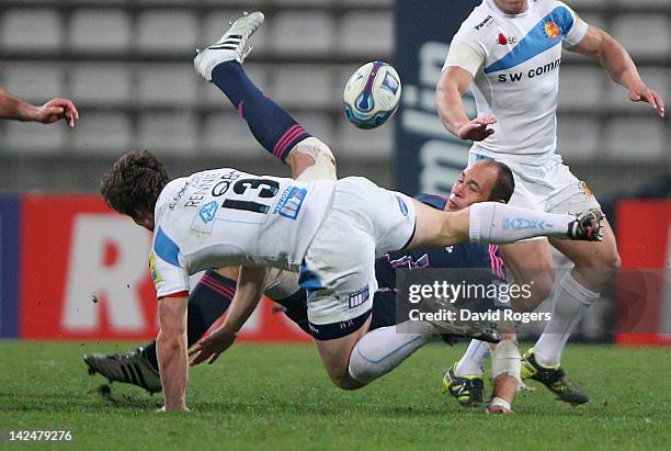 Sergio Parisse of Stade Francais is tackled by Bryan Rennie during the Amlin Challenge Cup quarter final match between Stade Francais and Exeter...