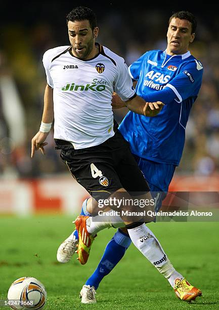 Adil Rami of Valencia CF competes for the ball with Maarten Martens of AZ Alkmaar during the UEFA Europa League quarter final second leg match...