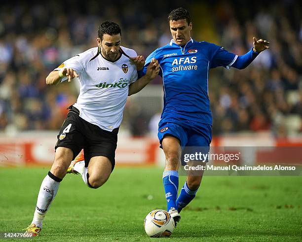 Adil Rami of Valencia CF competes for the ball with Maarten Martens of AZ Alkmaar during the UEFA Europa League quarter final second leg match...