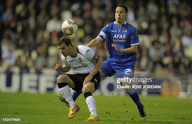 Valencia's forward Roberto Soldado vies for the ball with AZ Alkmaar's midfielder Maartens Martens during the UEFA Europe League quarter final second...