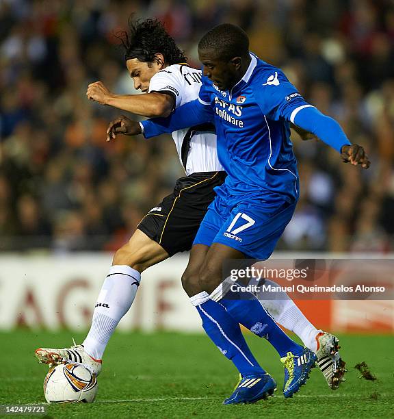 Tino Costa of Valencia CF competes for the ball with Jozy Altidore of AZ Alkmaar during the UEFA Europa League quarter final second leg match between...