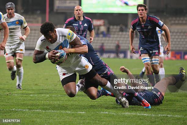 Sireli Naqelevuki of Exeter dives over for a try during the Amlin Challenge Cup quarter final match between Stade Francais and Exeter Chiefs at Stade...