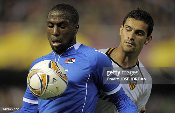 Alkmaar 's forward Jozy Altidor vies for the ball with Valencia's Portuguese defender Ricardo Costa during the UEFA Europe League quarter final...