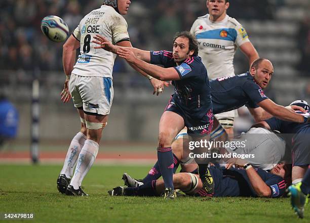 Julien Dupuy of Stade Francais passes the ball during the Amlin Challenge Cup quarter final match between Stade Francais and Exeter Chiefs at Stade...