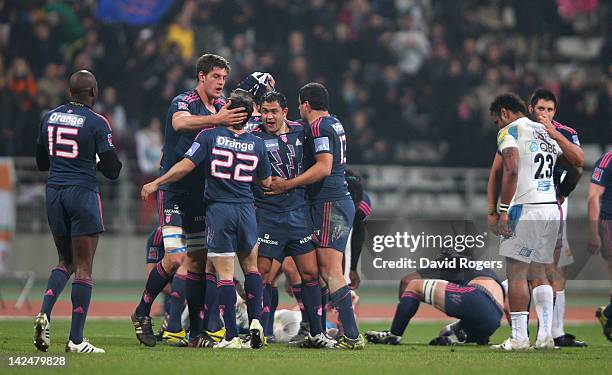 Stade Francais celebrate their victory at the final whistle during the Amlin Challenge Cup quarter final match between Stade Francais and Exeter...