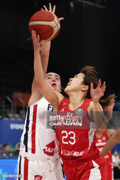Mai Yamamoto of Japan is challenged by Marine Fauthoux of France during the 2022 FIBA Women's Basketball World Cup Test Event match between Japan and...