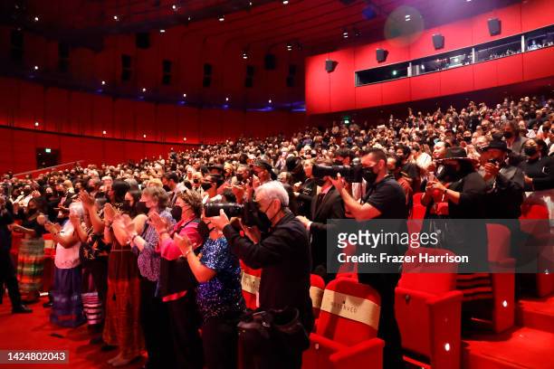 The audience gives a standing ovation to Sacheen Littlefeather at AMPAS Presents An Evening with Sacheen Littlefeather at Academy Museum of Motion...