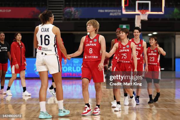 Maki Takada of Japan shakes hands with Helena Ciak of France after the 2022 FIBA Women's Basketball World Cup Test Event match between Japan and...