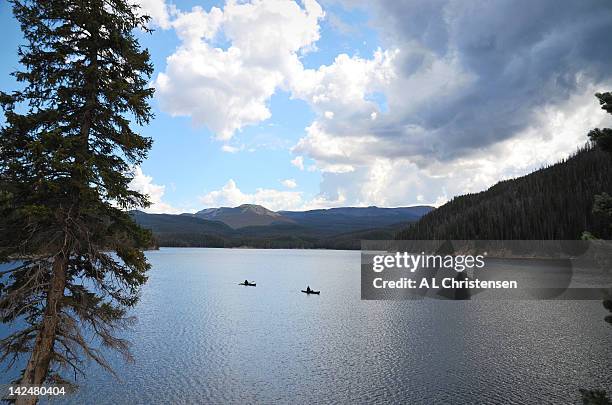 canoers on chambers lake - walden stock pictures, royalty-free photos & images