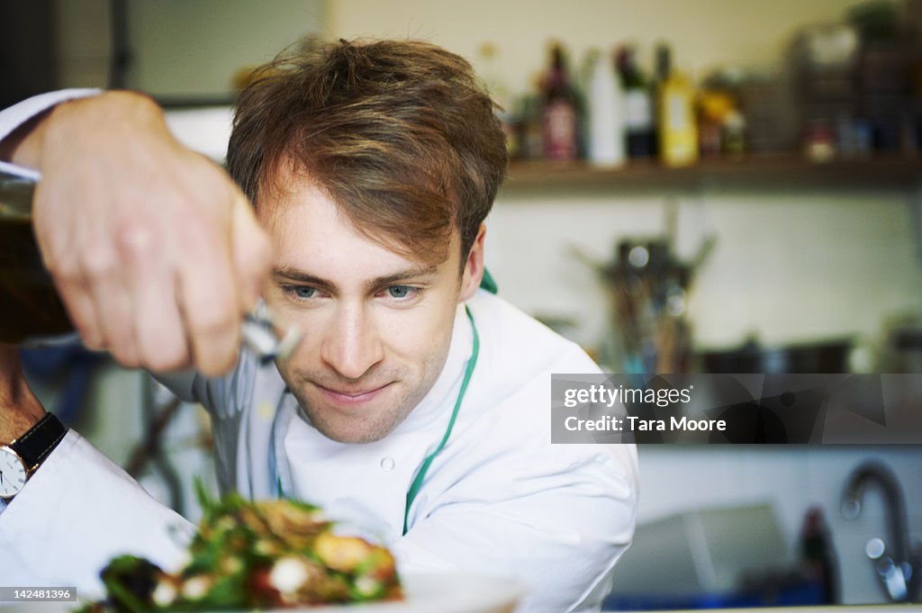 Chef preparing meal in restaurant