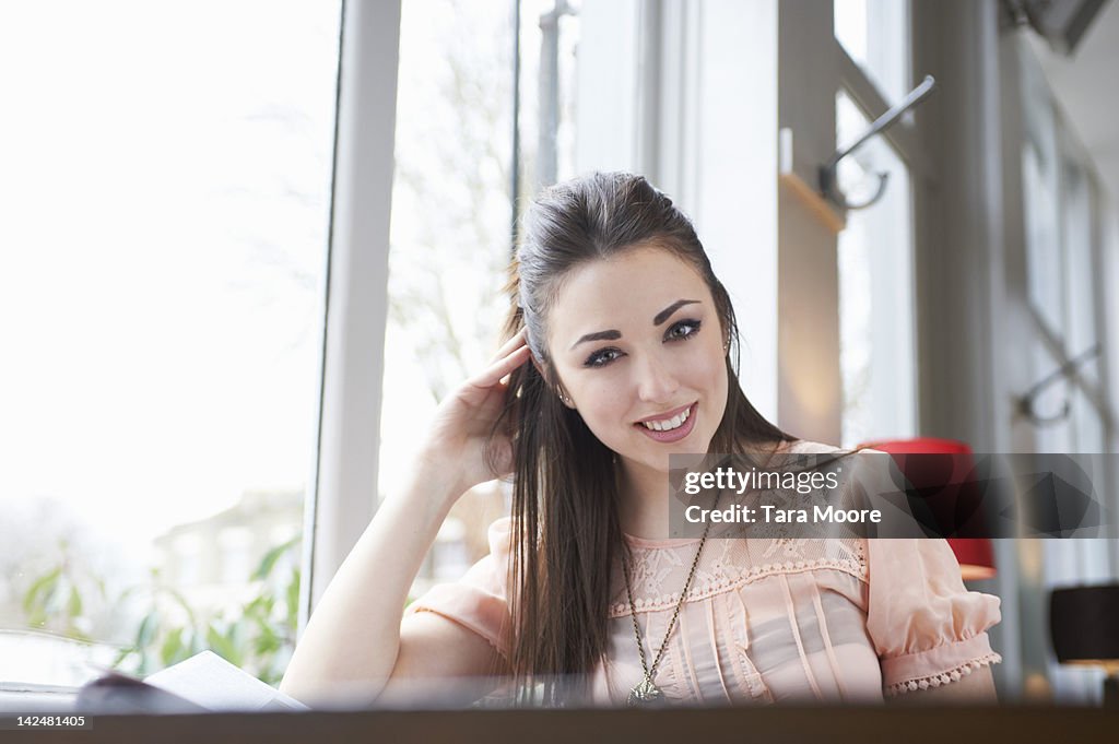 Portrait of woman smiling in restaurant