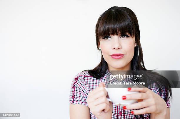 woman holding coffee cup - fringe stock pictures, royalty-free photos & images