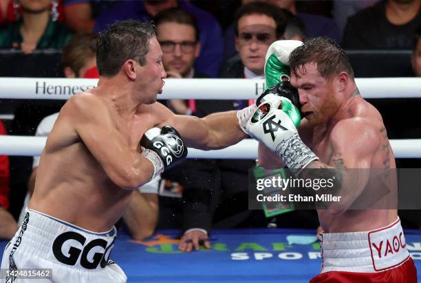 Gennadiy Golovkin hits Canelo Alvarez in the 12th round round of their super middleweight title fight at T-Mobile Arena on September 17, 2022 in Las...
