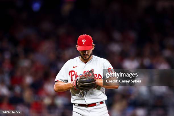 Brad Hand of the Philadelphia Phillies gets ready to deliver a pitch in the bottom of the eighth inning of a game against the Atlanta Braves at...