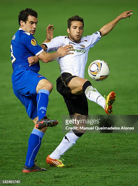 Jordi Alba of Valencia CF competes for the ball with Dirk Marcellis of AZ Alkmaar during the UEFA Europa League quarter final second leg match...