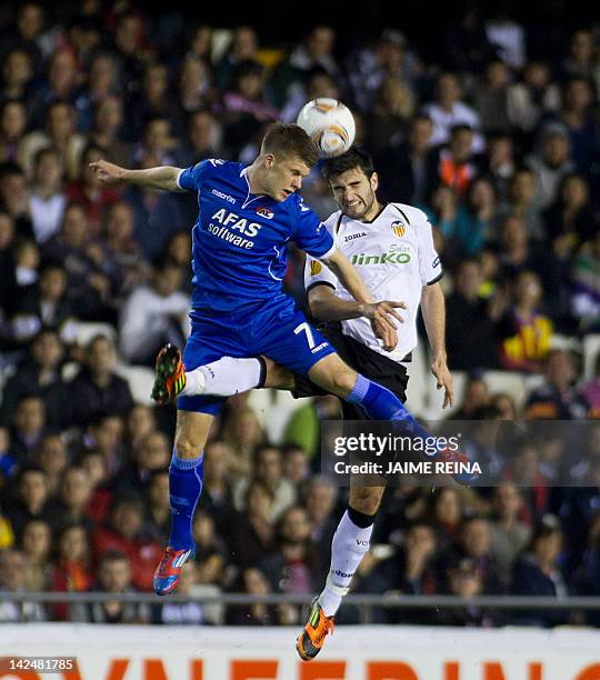 Valencia«s defender Antonio Barragan vies with AZ Alkmaar 's forward Johann Gudmundsson during the UEFA Europa League quarter-final second leg...