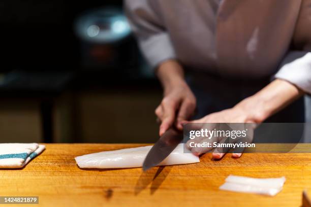 chef cutting sashimi on cutting board - cuttlefish stock pictures, royalty-free photos & images