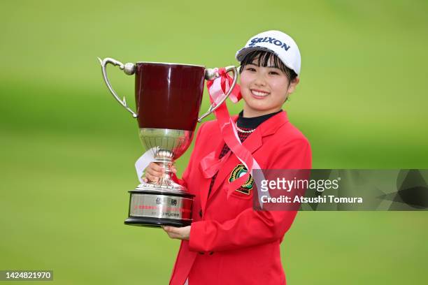 Amiyu Ozeki of Japan poses with the trophy after winning the tournament following the final round of Sumitomo Life Vitality Ladies Tokai Classic at...