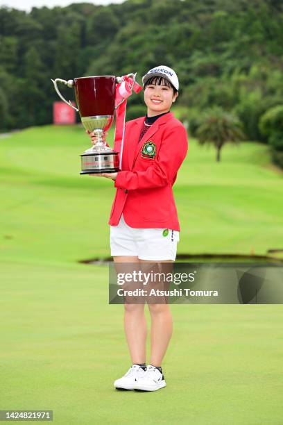 Amiyu Ozeki of Japan poses with the trophy after winning the tournament following the final round of Sumitomo Life Vitality Ladies Tokai Classic at...