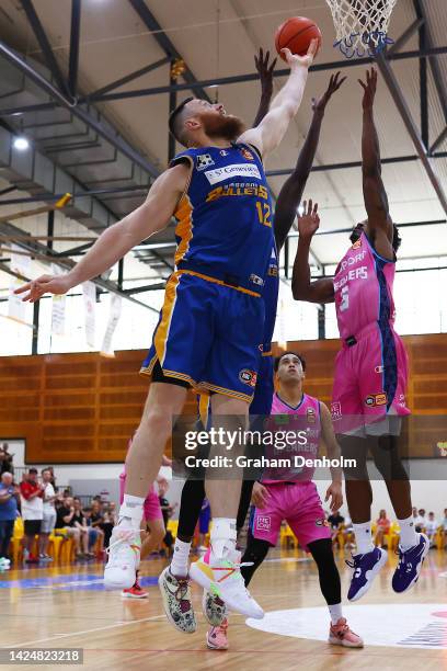 Aron Baynes of the Bullets competes in the air during the NBL Blitz match between Brisbane Bullets and New Zealand Breakers at Darwin Basketball...