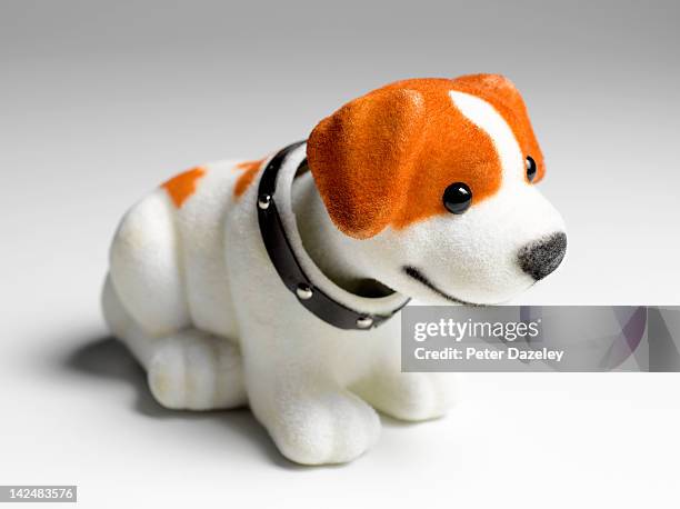 nodding dog with copy space - bobble head doll stock-fotos und bilder