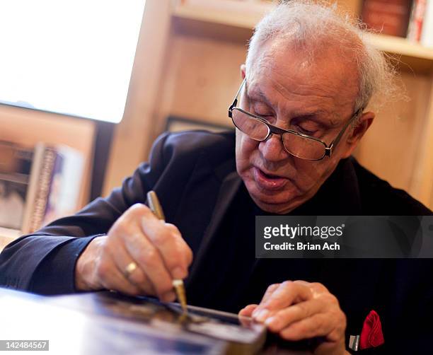 Photographer Ron Galella signs copies of "Paparazzo Extraordinaire" at BookMarc on April 5, 2012 in New York City.