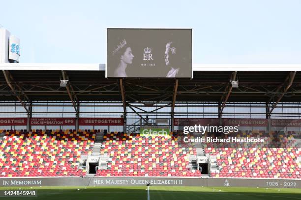 General view inside the stadium is seen as an LED board inside the stadium displays a tribute to Her Majesty Queen Elizabeth II who died at Balmoral...