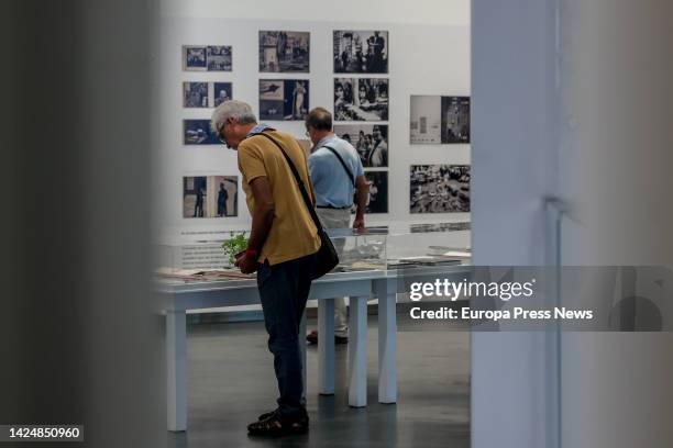 Two people look at some of the images that make up the exhibition 'Fotografia publica. Los años sesenta / The Sixties' at CentroCentro, on 18...