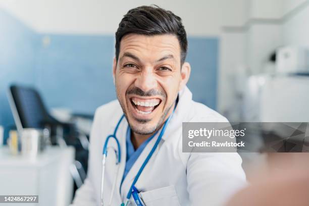 selfie of a laughing doctor - doctor selfie stock pictures, royalty-free photos & images
