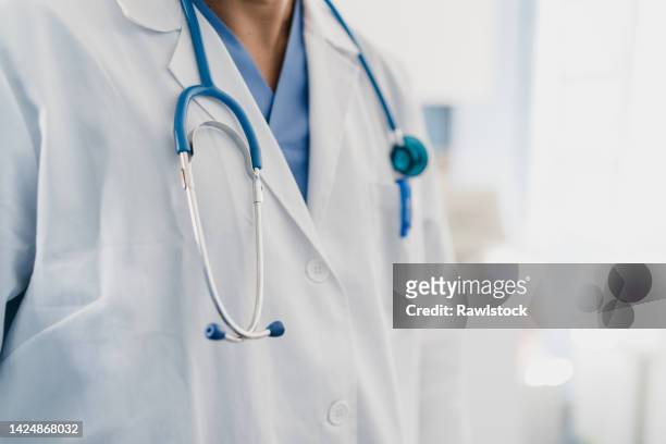 close-up of a doctor's gown with stethoscope - medical ストックフォトと画像