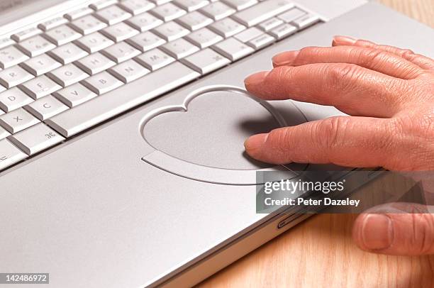 senior man looking for love online - touchpad stockfoto's en -beelden