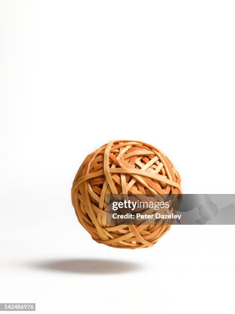 bouncing ball of rubber bands - bouncing stock pictures, royalty-free photos & images