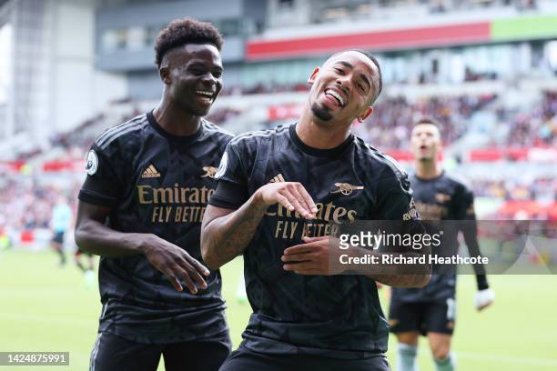 Gabriel Jesus of Arsenal celebrates with teammate Bukayo Saka after scoring their side's second goal during the Premier League match between...