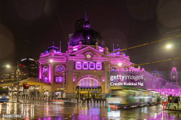 flinders street station lit in purple to honour queen elizabeth ii - violet manners stock pictures, royalty-free photos & images