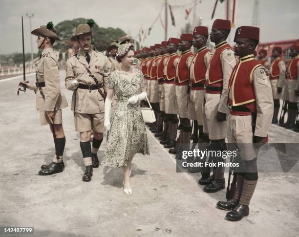 Queen Elizabeth II inspects men of the newly-renamed Queen's Own Nigeria Regiment, Royal West African Frontier Force, at Kaduna Airport, Nigeria,...