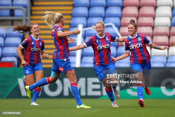 Coral-Jade Haines of Crystal Palace celebrates with teammates after scoring their side's first goal during the Barclays FA Women's Championship match...