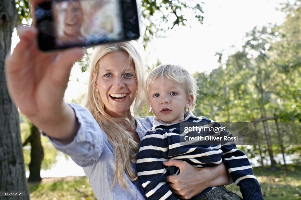 Mother and child taking photos